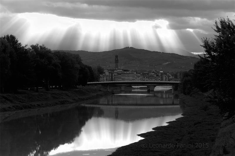 Florence under sun pierced clouds