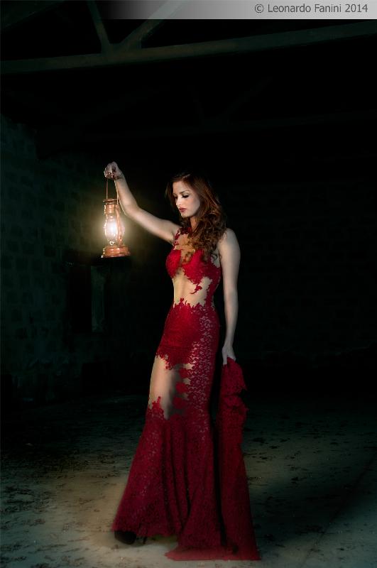 a lamp and a sexy red dress in a abandoned depot